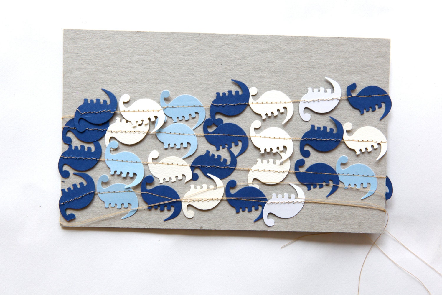 mini blue and white dinosaur garland