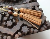 Pair of long dangle leather and glass beads earrings