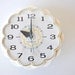 Vintage wall clock, white with scalloped edges and aqua blue second hand