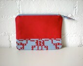 Red cotton purse with screen printed panel, top zip