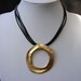Black Leather Necklace with unique Gold Plated circle