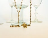Kahki Topaz Colored Crystal and Gold Skull Delicate Rosary Necklace