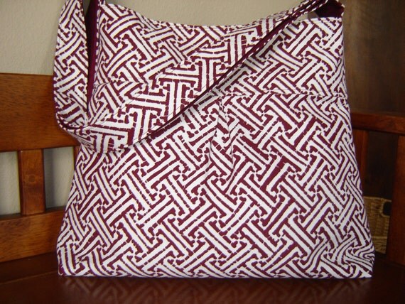 Cross body bag with adjustable strap red and white geometric print