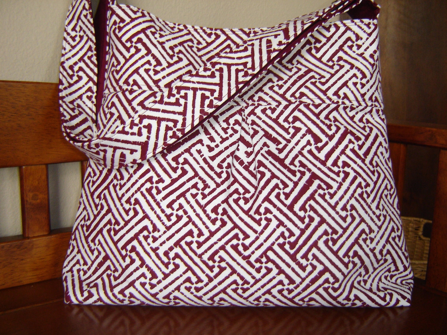 Cross body bag with adjustable strap red and white geometric print