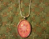 Pink floral pendant, with matching silver snake chain necklace