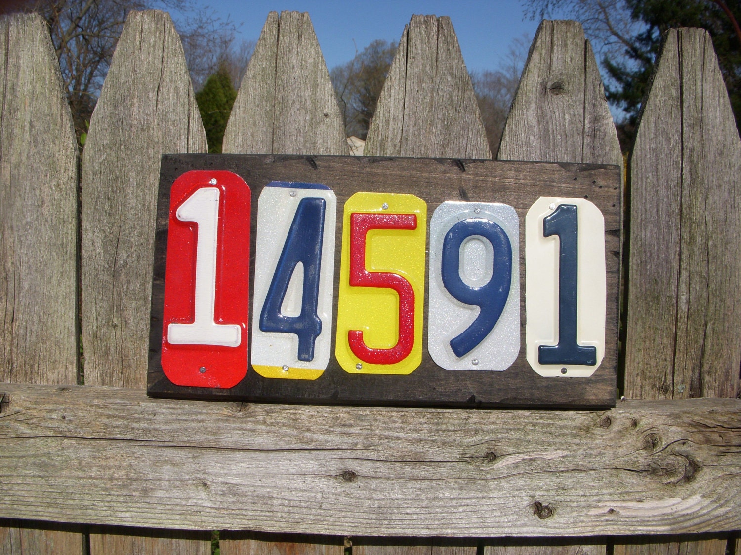 Custom made 5 number address sign made with recycled license plates.