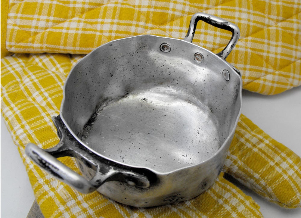 Very, very old mini aluminium casserole. Very cute. Used again and again