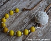 Hello Sunshine. Yellow beaded necklace with white rosette