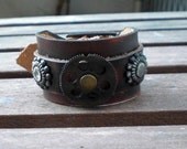 Leather Cuff Bracelet, with steampunk gears, antique Rivets and Buckle Closure