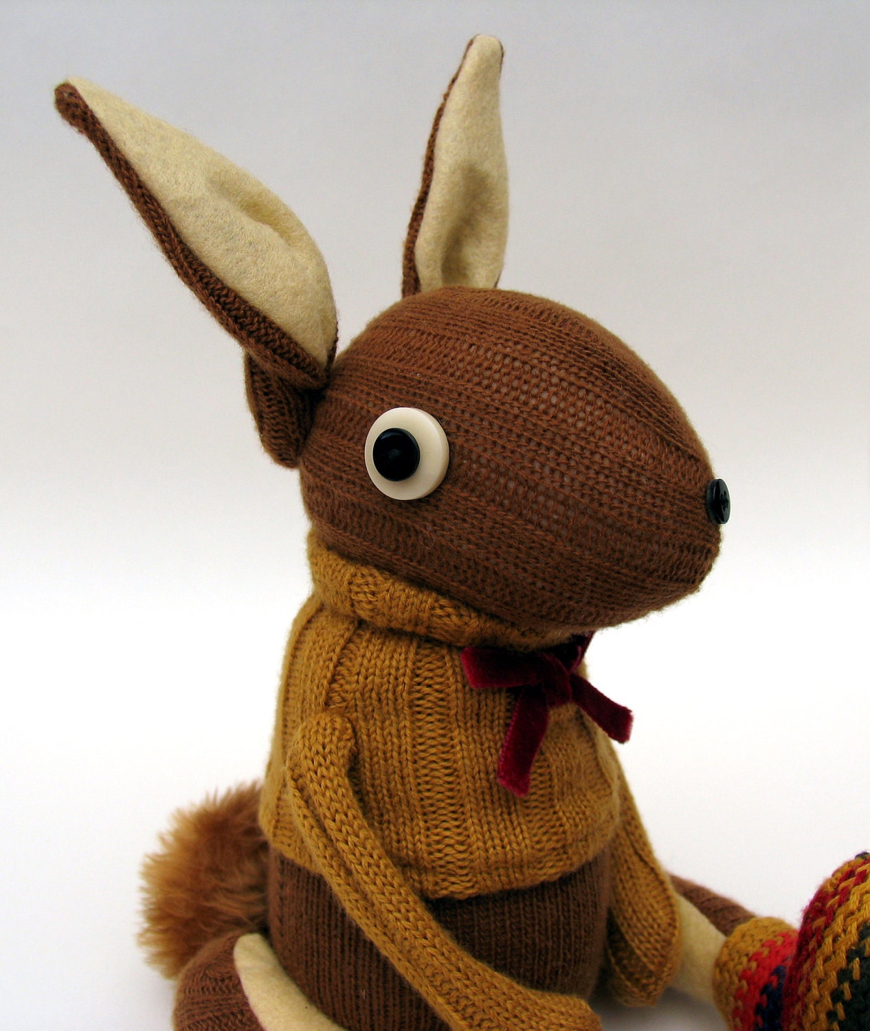 Woollen Rabbit - Handmade plush sculpture - brown woollen body with flesh coloured felt ears - wearing mustard woolly pullover.