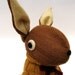 Woollen Rabbit - Handmade plush sculpture - brown woollen body with flesh coloured felt ears - wearing mustard woolly pullover.