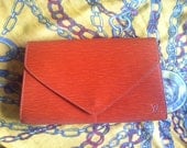 Vintage Louis Vuitton epi envelop style clutch with LV embossed. Trapezoidal shape