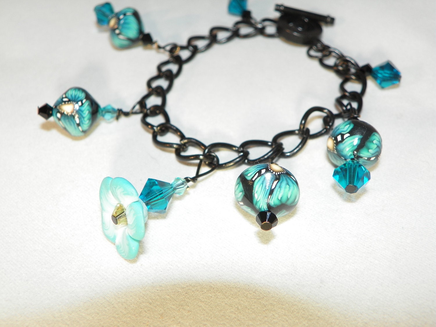 Black Metal and Polymer clay charm Bracelet with Turquoise flowers and beads