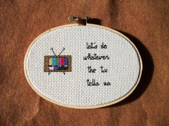 Television cross stitch -- Let's do whatever the TV tells us
