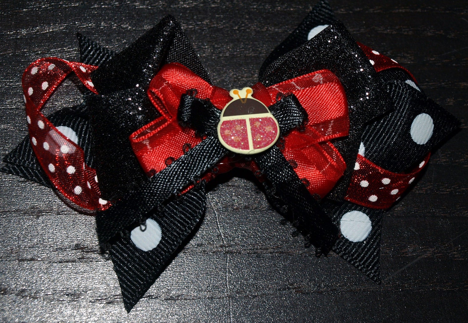 red and black lady bug bow