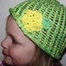 spring hat green and yellow with flower