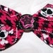 pink and black houndstooth and skull hair bow