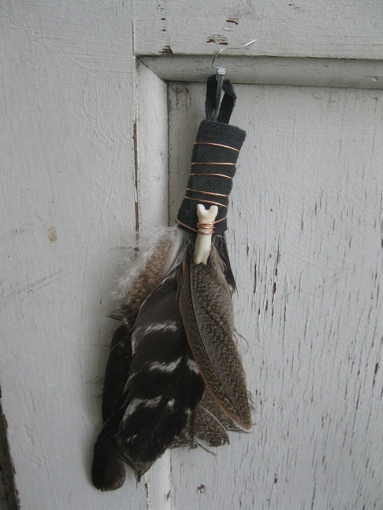 cruelty free black leather wrapped tribal feather earring single with real bob cat toe bone
