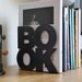 Modern stylish bookend BookOne black or white powder coated laser cut metal thick enough to hold books