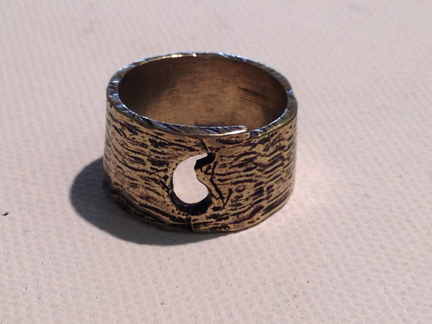 Emblem Ring (paisley cutout) in Bronze, White Bronze, Brass, or Sterling Silver.