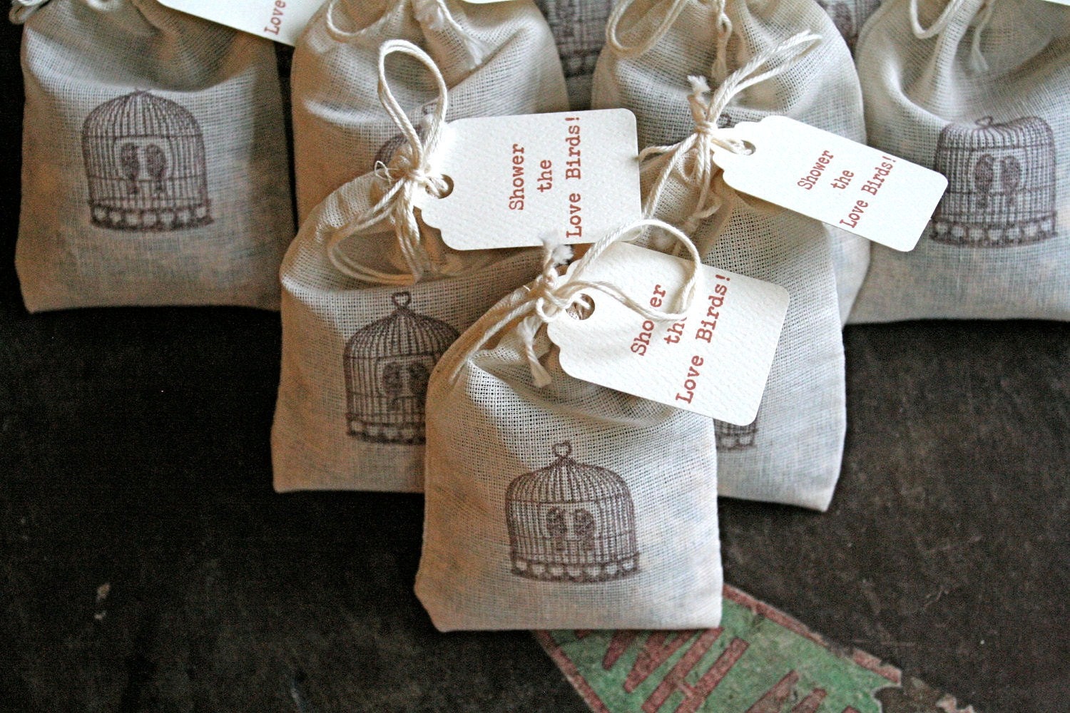 Wedding favor, bird seed toss favors. 50 muslin bags, 2x4, flilled with bird seed. Bird cage design and lovebird tag.