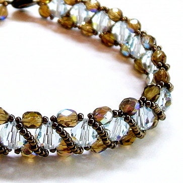 Ice blue bracelet woven with bronze crystals