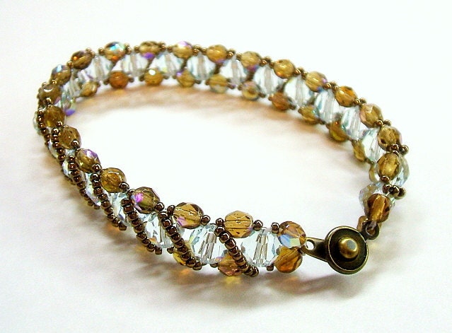 Ice blue bracelet woven with bronze crystals