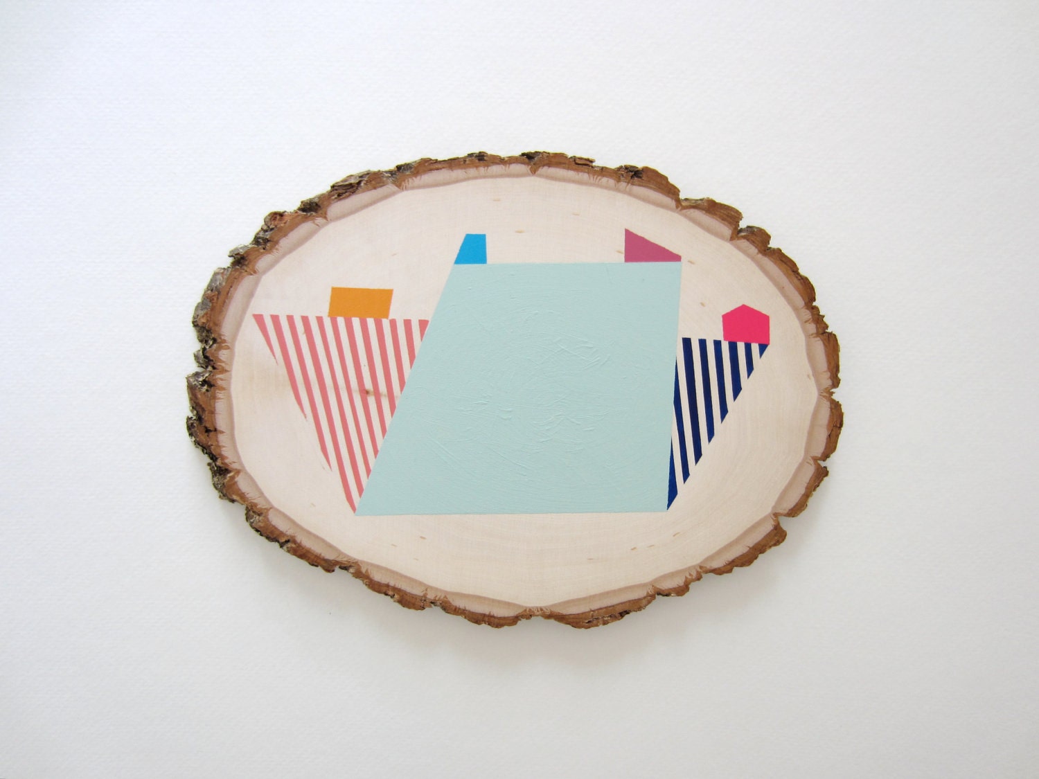 Wood wall art geometric pastel tree slice painting with colorful abstract shapes and stripes: original art