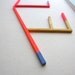 Neon geometric art, abstract painting, unusual stick painting on wood