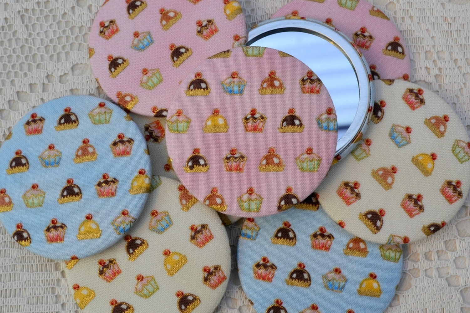 Cupcake fabric covered pocket mirror, available in pink, blue or cream with organza gift bag