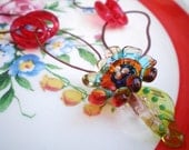 Ring a Ring o'Roses necklace- colorful lampwork flower headpins. vintage rings. floral material. Fiber floral shabby chic. Jettabugjewelry