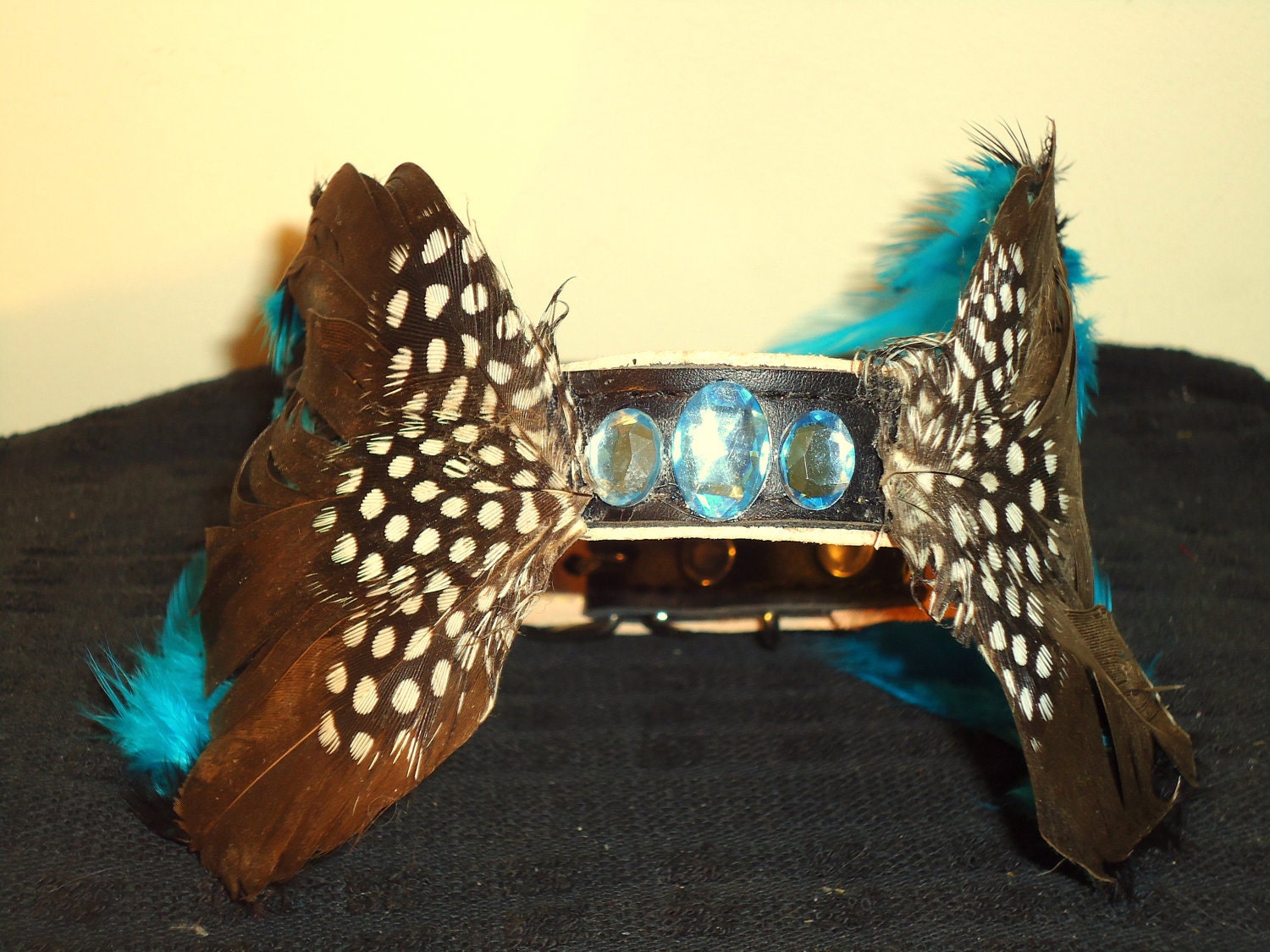 Couture dog collar.Blue and brown feather plumage surround  with faux jewel center. OOAK.