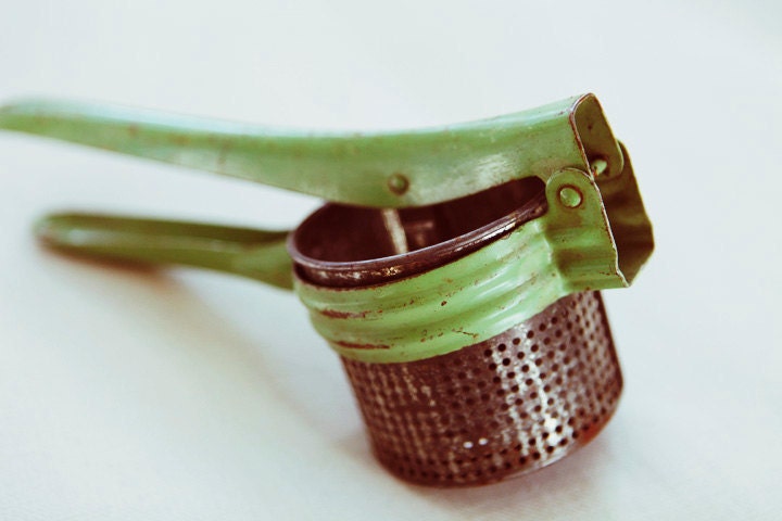 potato famine - vintage industrial green potato ricer