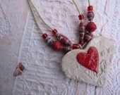 Necklace with heart pendant and paper beads