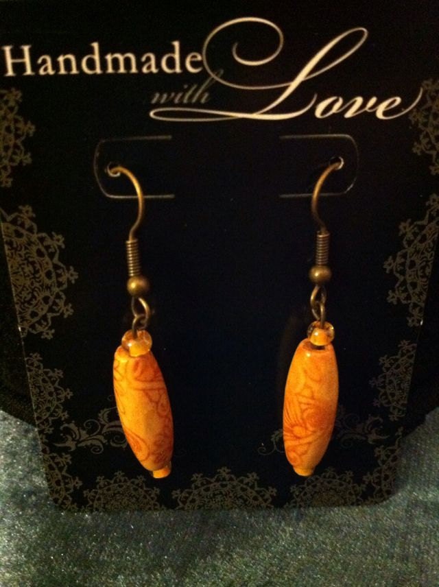 Light wood bead earrings with light floral print