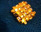 Leprechaun's Buttons - five gold vintage plastic shank style buttons