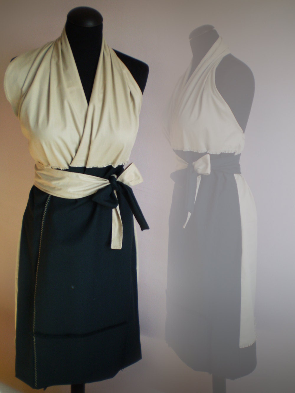 black and beige wrap dress with a belt and open back
