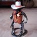 Cowboy Collectable good guy meeting up with the bad guy at high noon.