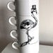 Dapper Flamingo stacking teacups