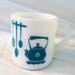 Vintage milk glass mug with teal design