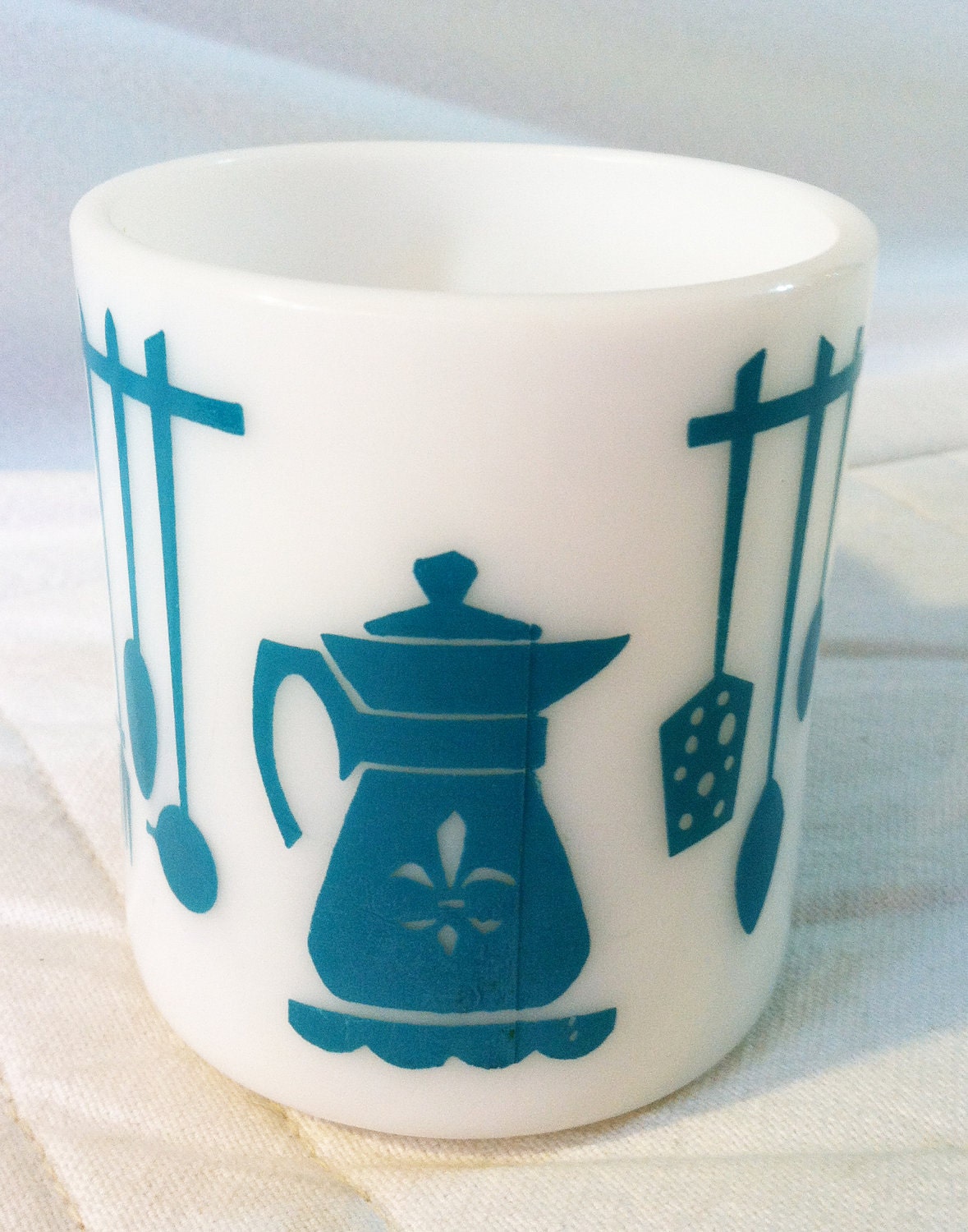 Vintage milk glass mug with teal design