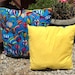 Two pillows small and large hot air balloon pillow with yellow backing. comes in 2 sizes
