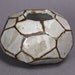 Faceted brown and white vase.