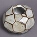 Faceted brown and white vase.