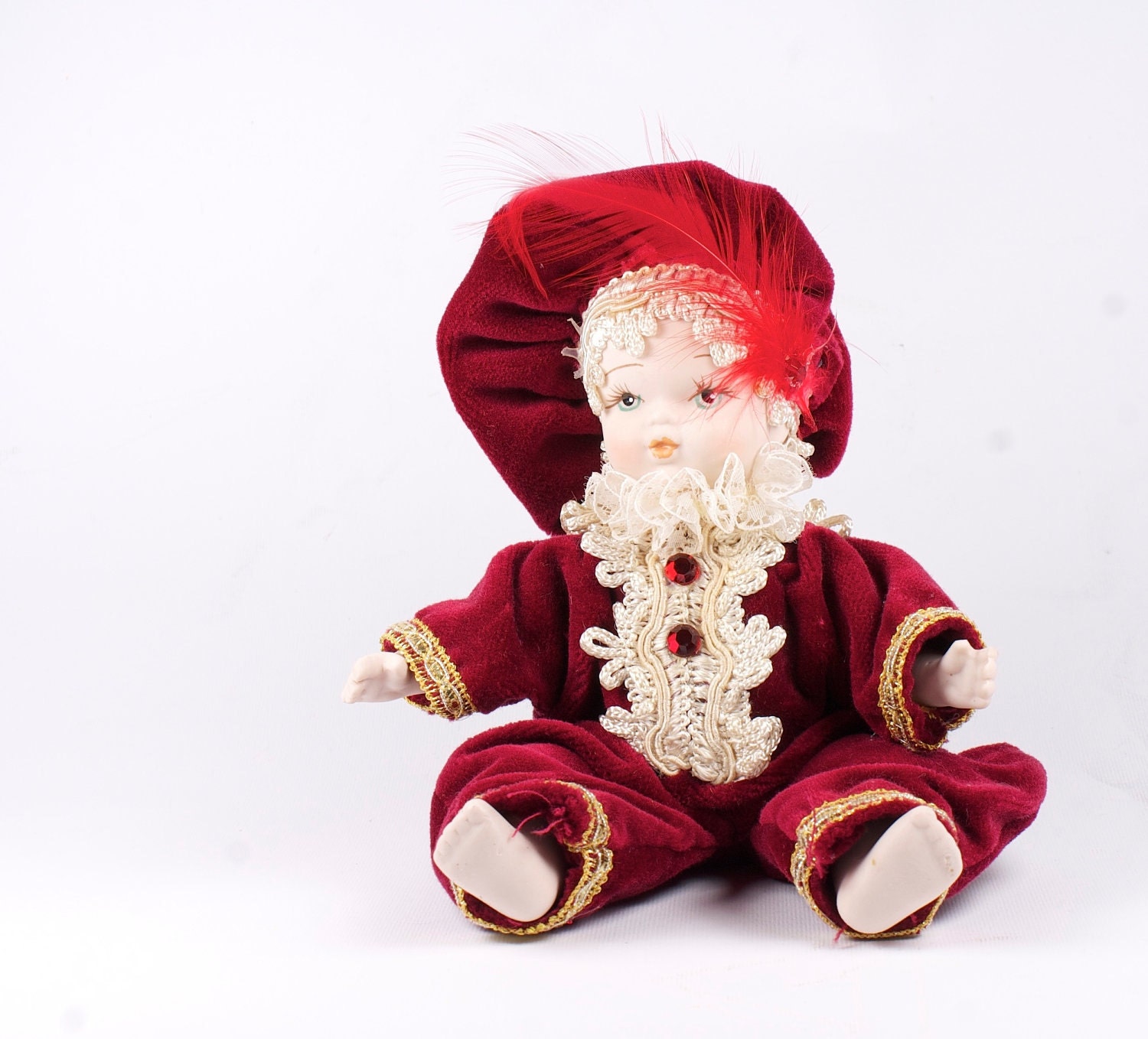 Vintage porcelain doll. Deep red.