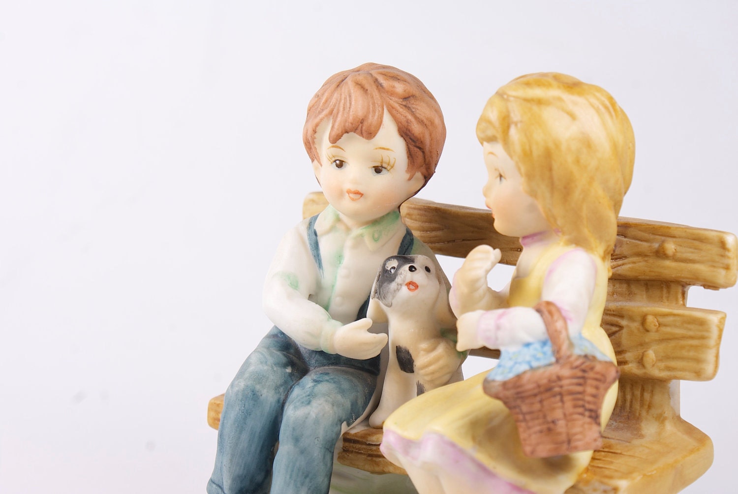 Vintage pastels porcelain figurines. Children and dog.