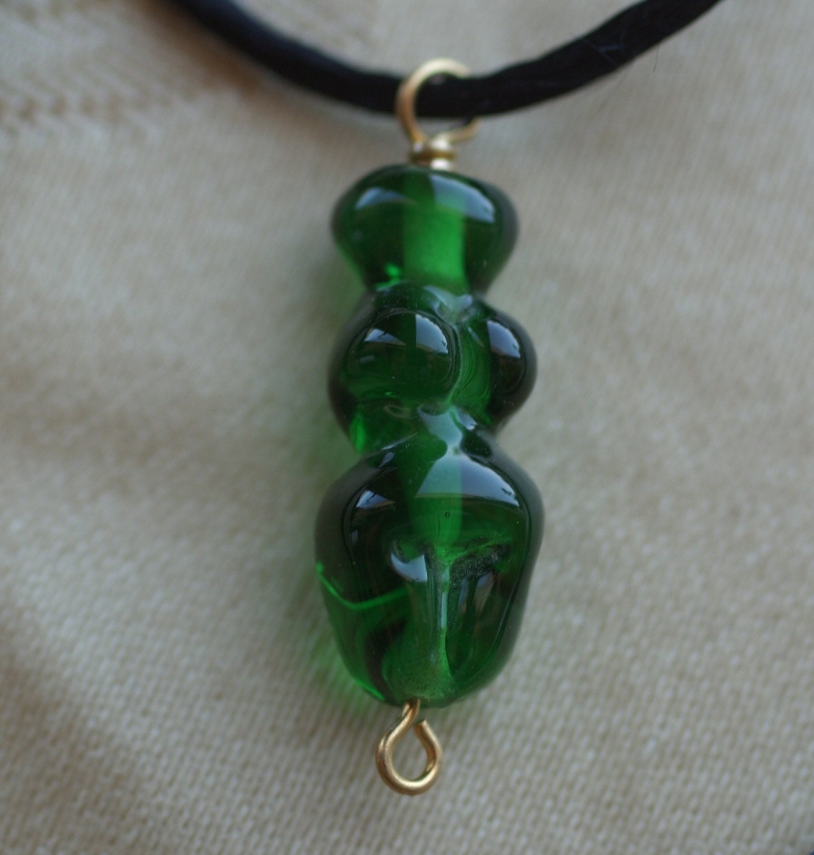 Emerald Green Lampwork Goddess on a Black Satin Cord