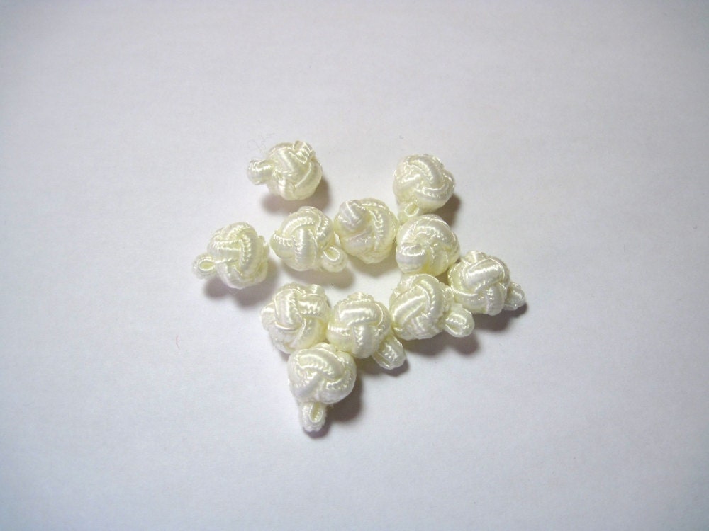 Vintage cream knotted buttons