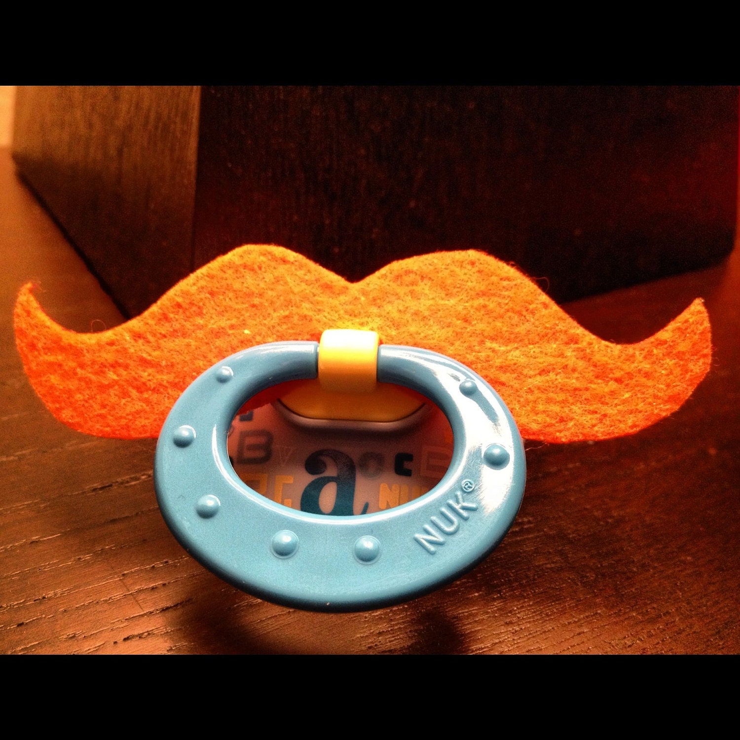 Luck of the Irish Mustache Pacifier - Orange Strongman