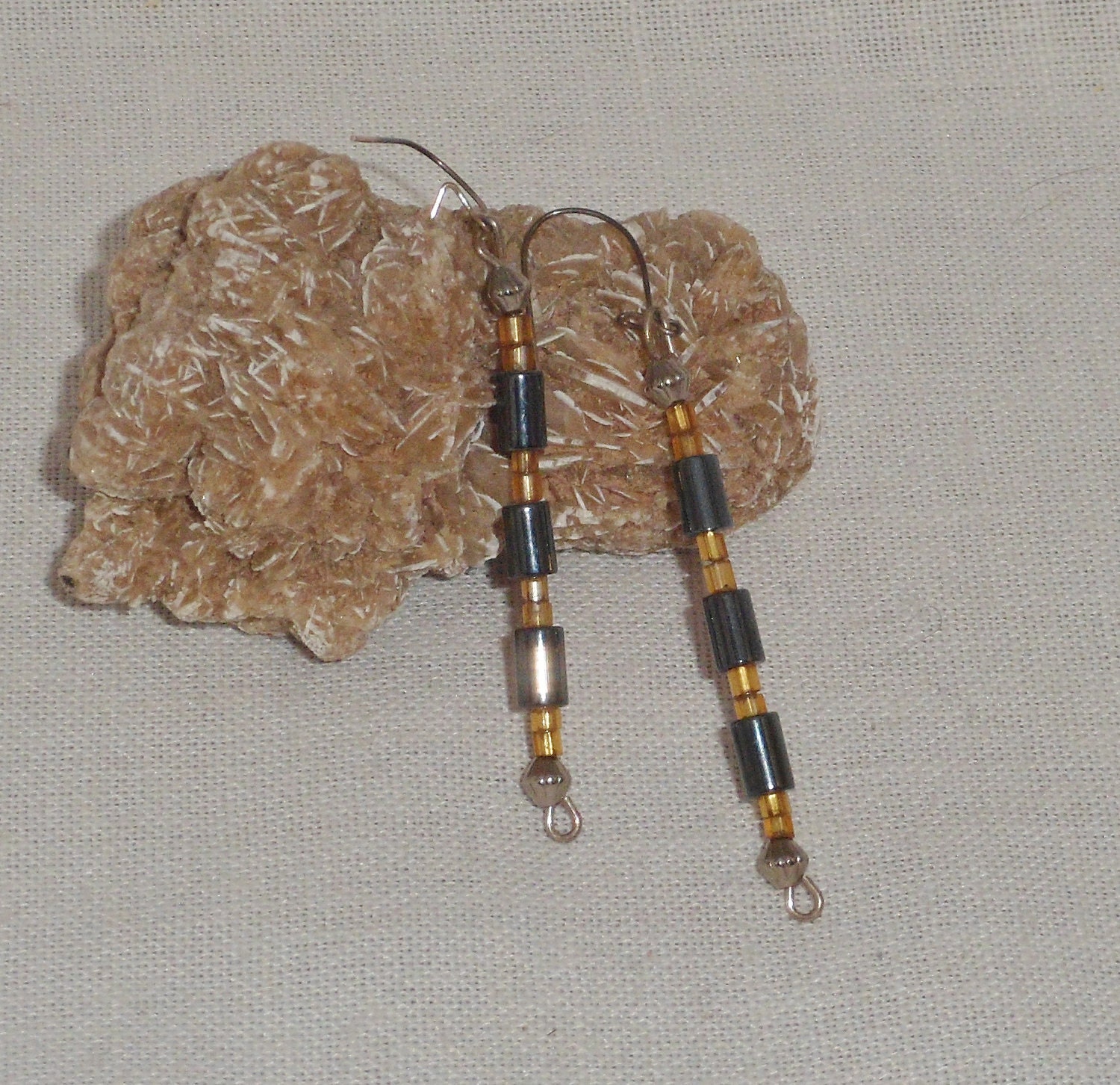 Earrings of hematite & yellow vintage beads with silver balls on each end